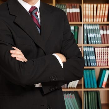 Cruise Injury Attorney In Front Of Law Book Library