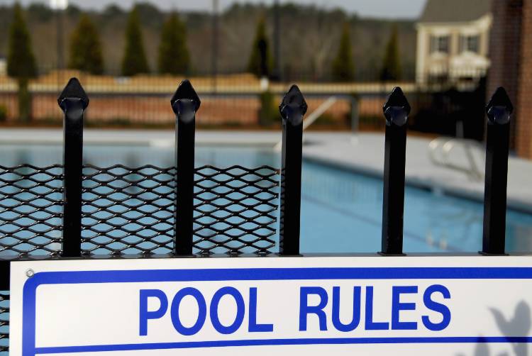 Metal Pool Gate With Pool Rules Sign